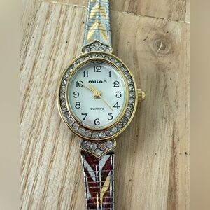 Milan ladies oval tel tone watch NEW BATTERY